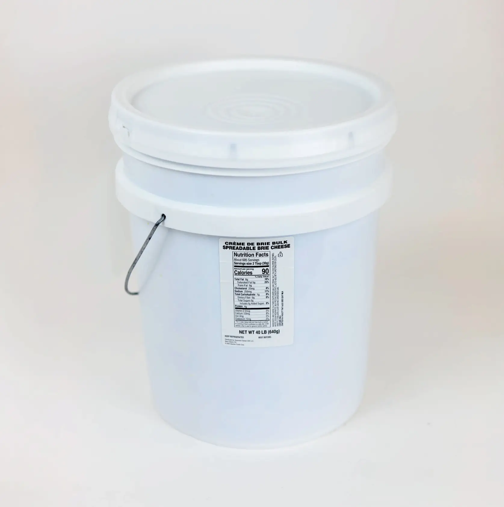 White bulk container of crème de brie spreadable cheese with nutrition facts label and metal handle, 40 lb net weight.